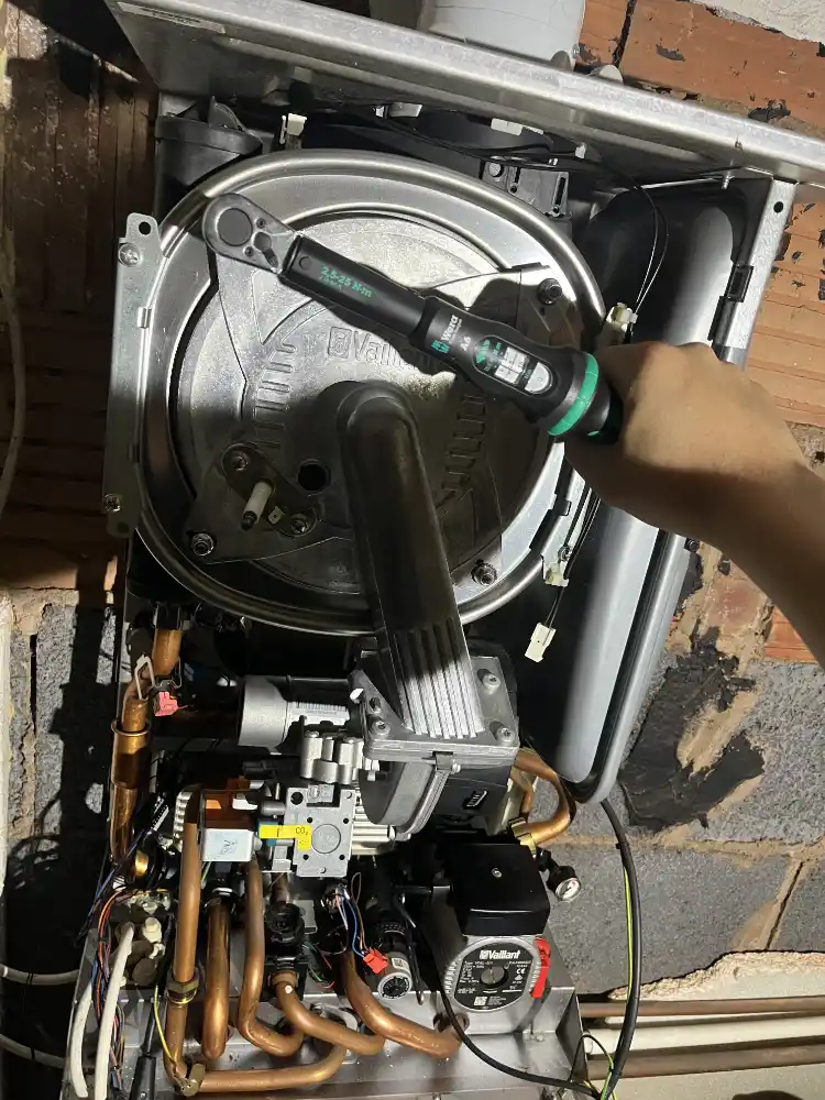 Open boiler undergoing servicing by JWC Plumbing and Heating